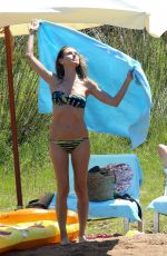 HEIDI KLUM in Bikini at a Beach in Corsica 07/25/2018