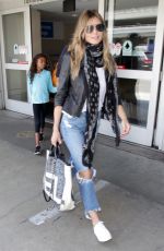 HEIDI KLUM in Ripped Jeans at LAX Airport in Los Angeles 07/08/2018
