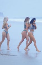 KIM KARDASHIAN and Friends in Bikini Doing Yoga on the Beach in Los Angeles 07/11/2018
