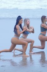 KIM KARDASHIAN and Friends in Bikini Doing Yoga on the Beach in Los Angeles 07/11/2018