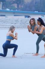 KIM KARDASHIAN and Friends in Bikini Doing Yoga on the Beach in Los Angeles 07/11/2018
