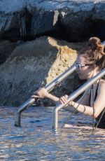 LILY COLLINS in Swimsuit at a Beach in Ischia 07/18/2018