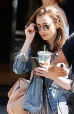LILY COLLINS Out and About in Barcelona 07/12/2018