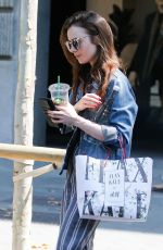 LILY COLLINS Out and About in Barcelona 07/12/2018