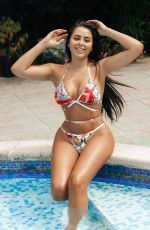 MARNIE SIMPSON in Bikini at a Pool in Marbella 07/10/2018