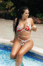MARNIE SIMPSON in Bikini at a Pool in Marbella 07/10/2018