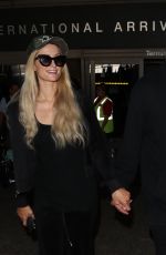 PARIS HILTON and Chris Zylka at LAX Airport in Los Angeles 07/27/2018