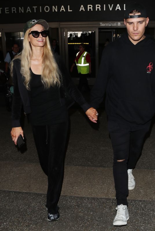 PARIS HILTON and Chris Zylka at LAX Airport in Los Angeles 07/27/2018