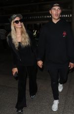 PARIS HILTON and Chris Zylka at LAX Airport in Los Angeles 07/27/2018