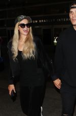 PARIS HILTON and Chris Zylka at LAX Airport in Los Angeles 07/27/2018