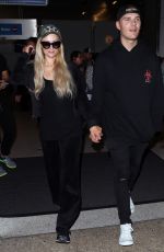 PARIS HILTON and Chris Zylka at LAX Airport in Los Angeles 07/27/2018