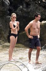 ROBIN WRIGHT in Bikini and Clement Giraudet at a Beach in Capri 07/22/2018