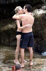 ROBIN WRIGHT in Bikini and Clement Giraudet at a Beach in Capri 07/22/2018