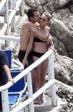 ROBIN WRIGHT in Bikini and Clement Giraudet at a Beach in Capri 07/22/2018