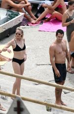 ROBIN WRIGHT in Bikini and Clement Giraudet at a Beach in Capri 07/22/2018