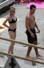 ROBIN WRIGHT in Bikini and Clement Giraudet at a Beach in Capri 07/22/2018