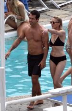 ROBIN WRIGHT in Bikini and Clement Giraudet at a Beach in Capri 07/22/2018