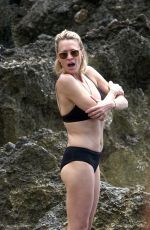 ROBIN WRIGHT in Bikini and Clement Giraudet at a Beach in Capri 07/22/2018