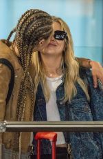 CARA DELEVINGNE and ASHLEY BENSON at Heathrow Airport in London 08/13/2018