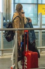 CARA DELEVINGNE and ASHLEY BENSON at Heathrow Airport in London 08/13/2018
