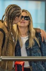 CARA DELEVINGNE and ASHLEY BENSON at Heathrow Airport in London 08/13/2018