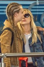 CARA DELEVINGNE and ASHLEY BENSON at Heathrow Airport in London 08/13/2018
