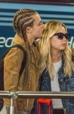 CARA DELEVINGNE and ASHLEY BENSON at Heathrow Airport in London 08/13/2018