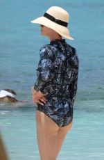 CHARLIZE THERON in Swimsuit at a Beach in Bahamas 08/18/2018