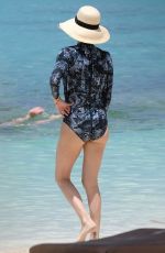 CHARLIZE THERON in Swimsuit at a Beach in Bahamas 08/18/2018
