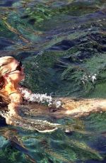 CHARLOTTE MCKINNEY in Bikini at a Beach in Capri 08/13/2018
