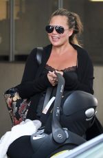 CHRISSTY TEIGEN in Ripped Jeans Out in Los Angeles 08/22/2018