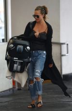 CHRISSTY TEIGEN in Ripped Jeans Out in Los Angeles 08/22/2018