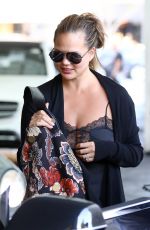 CHRISSTY TEIGEN in Ripped Jeans Out in Los Angeles 08/22/2018