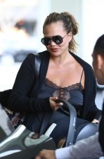 CHRISSTY TEIGEN in Ripped Jeans Out in Los Angeles 08/22/2018