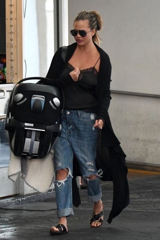 CHRISSTY TEIGEN in Ripped Jeans Out in Los Angeles 08/22/2018