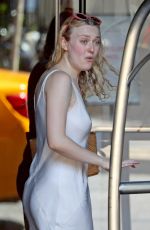 DAKOTA FANNINF with a Luggage Cart Out in New York 08/23/2018