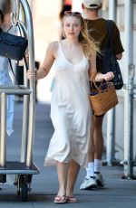 DAKOTA FANNINF with a Luggage Cart Out in New York 08/23/2018