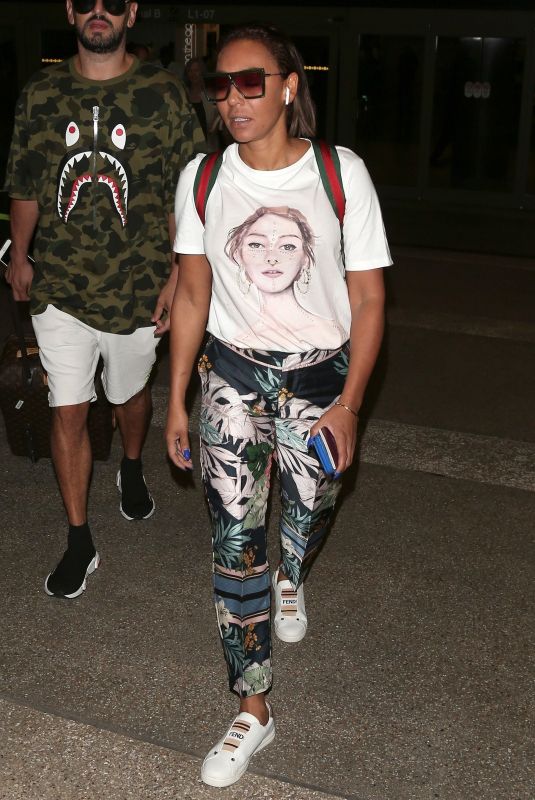 MELANIE BROWN at LAX Airport in Los Angeles 08/20/2018