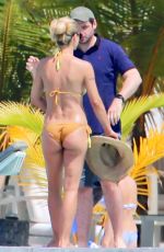 MICHELLE HUNZIKER in Bikinis on the Beach in Maldives 08/12/2018