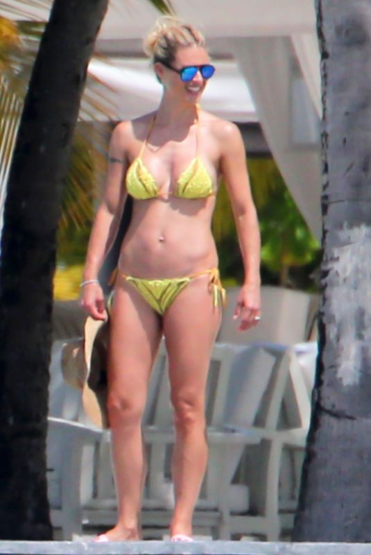 MICHELLE HUNZIKER in Bikinis on the Beach in Maldives 08/12/2018