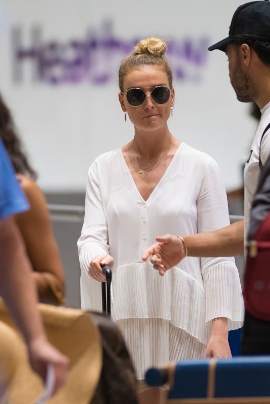 PERRIE EDWARDS at Heathrow Airport in London 08/12/2018