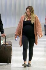 Pregnant HILARY DUFF at JFK Airport in New York 08/26/2018