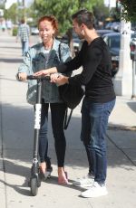 KENDRA WILKINSON Rides a Scooter Out in West Hollywood 09/21/2018