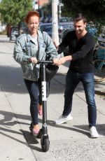 KENDRA WILKINSON Rides a Scooter Out in West Hollywood 09/21/2018