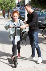 KENDRA WILKINSON Rides a Scooter Out in West Hollywood 09/21/2018