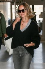 OLIVIA WILDE and Jason Sudekis at LAX Airport in Los Angeles 09/27/2018