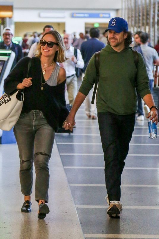 OLIVIA WILDE and Jason Sudekis at LAX Airport in Los Angeles 09/27/2018