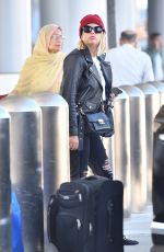 ASHLEY BENSON at LAX Airport in Los Angeles 10/05/2018