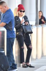 ASHLEY BENSON at LAX Airport in Los Angeles 10/05/2018