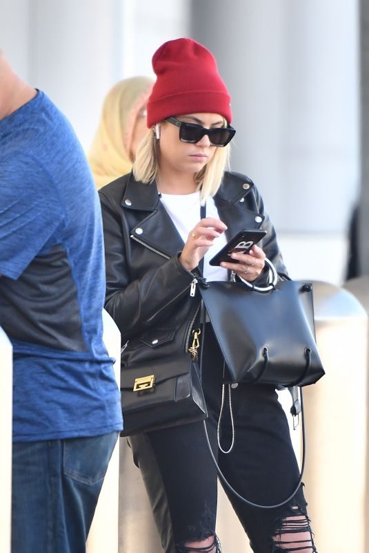 ASHLEY BENSON at LAX Airport in Los Angeles 10/05/2018